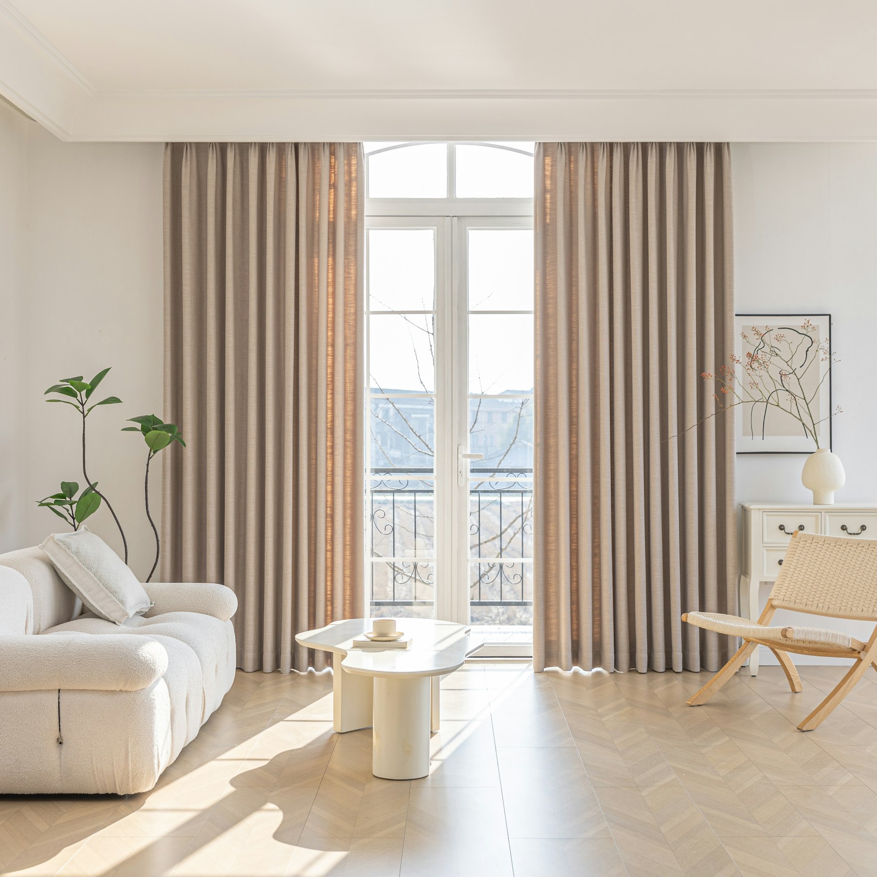 Warm neutral living room filled with natural light